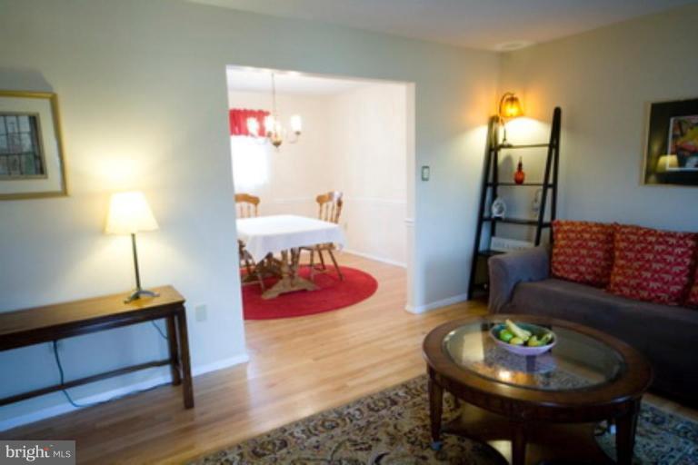 6512 Darwin Road Laurel, MD 20707 - Photo 6 of 22 a living room with furniture and a lamp