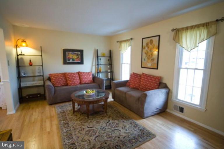 6512 Darwin Road Laurel, MD 20707 - Photo 8 of 22 a living room with a couch and a window