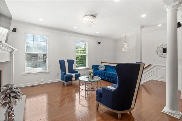 a living room with furniture rug and window