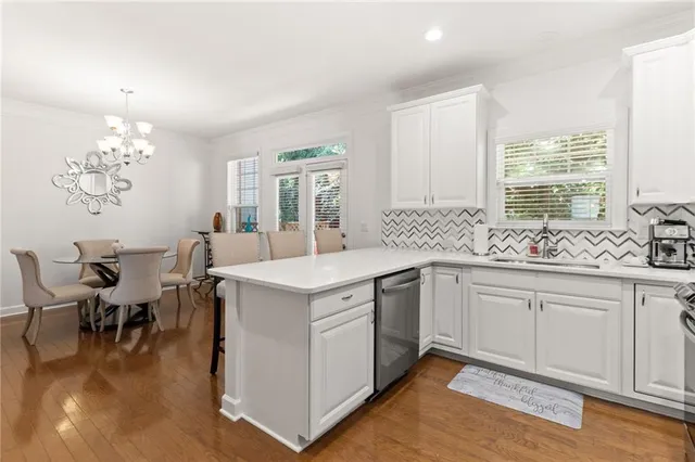 a kitchen with sink and cabinets