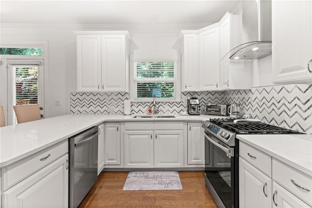 2086 Cobblestone Circle Northeast Atlanta, GA 30319 - Photo 18 of 34 a kitchen with a sink stove and cabinets