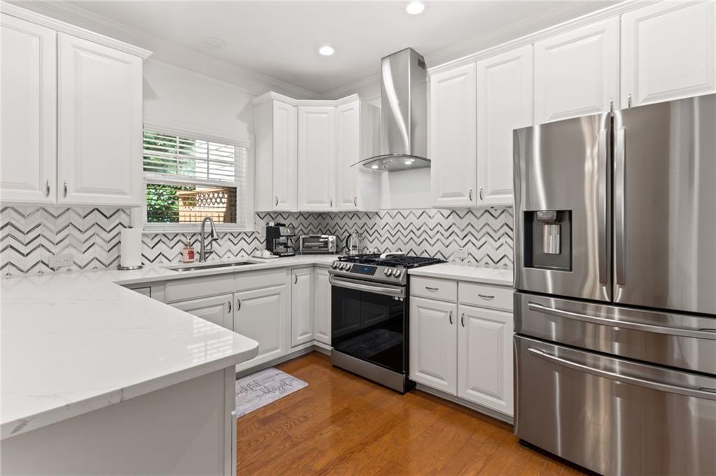 2086 Cobblestone Circle Northeast Atlanta, GA 30319 - Photo 19 of 34 a kitchen with a refrigerator sink and cabinets