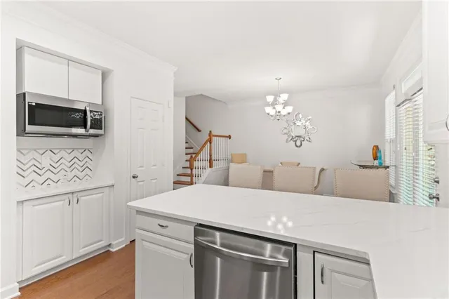 a view of a kitchen with a sink and a microwave