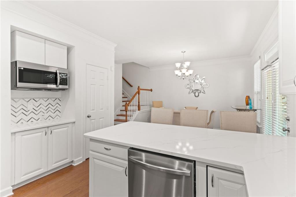 2086 Cobblestone Circle Northeast Atlanta, GA 30319 - Photo 20 of 34 a view of a kitchen with a sink and a microwave