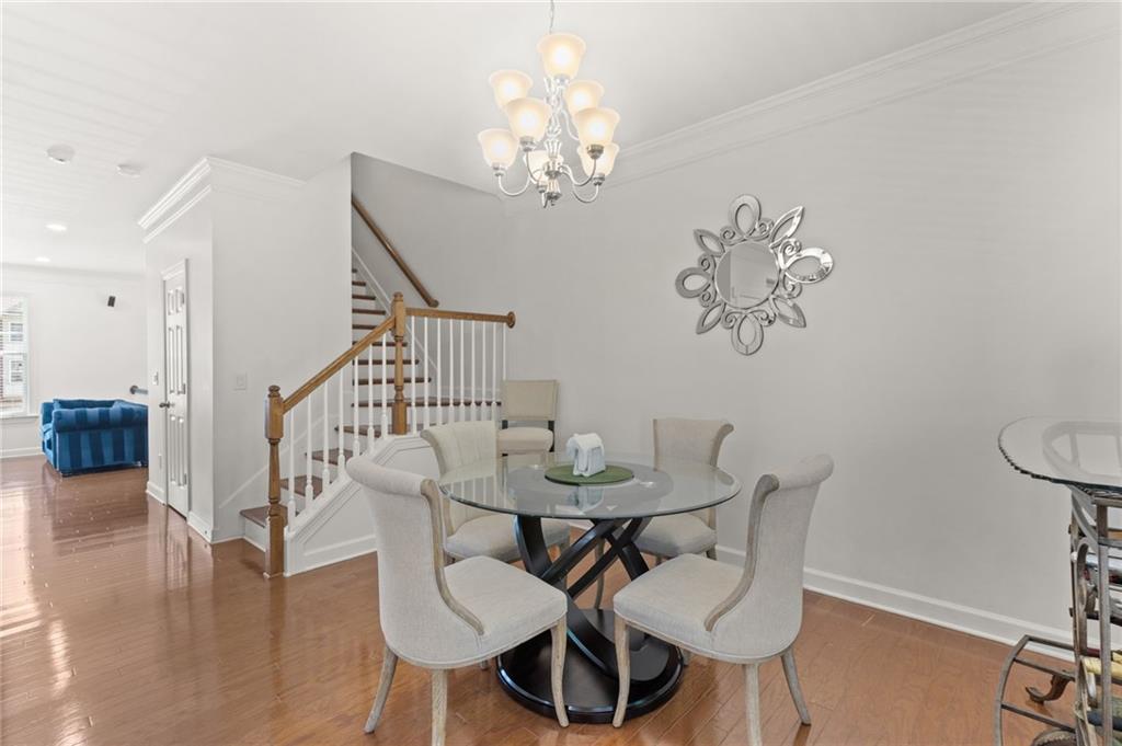 2086 Cobblestone Circle Northeast Atlanta, GA 30319 - Photo 22 of 34 a view of a dining room with furniture and wooden floor