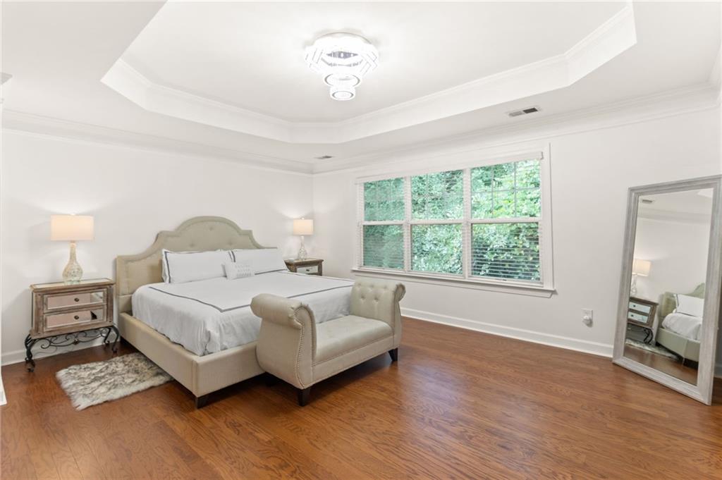 2086 Cobblestone Circle Northeast Atlanta, GA 30319 - Photo 24 of 34 a bedroom with a bed and a window