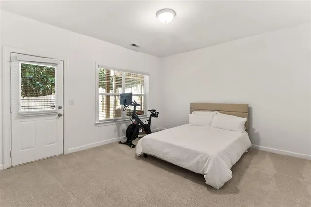 a bedroom with a bed and a table