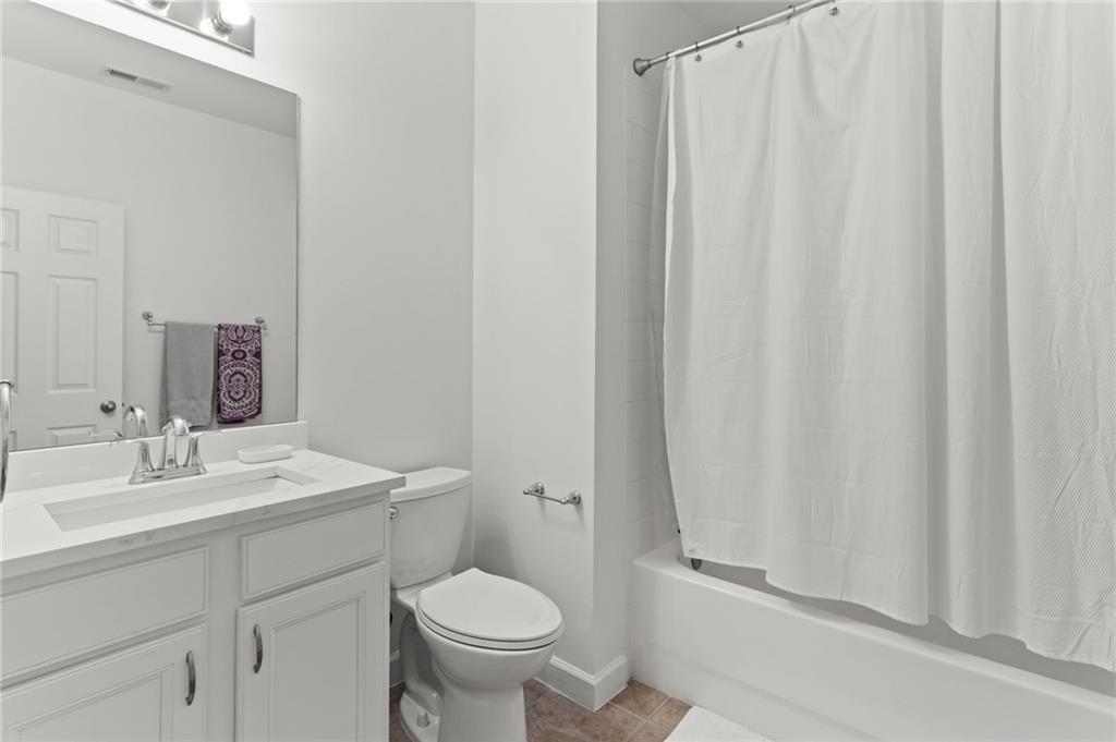 2086 Cobblestone Circle Northeast Atlanta, GA 30319 - Photo 29 of 34 a bathroom with a sink toilet and shower