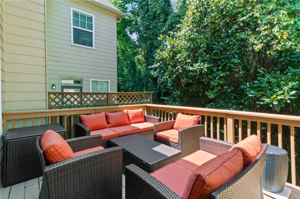 2086 Cobblestone Circle Northeast Atlanta, GA 30319 - Photo 34 of 34 a balcony with wooden floor and outdoor seating
