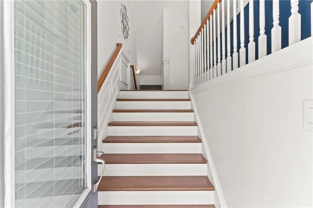 a view of staircase with white walls