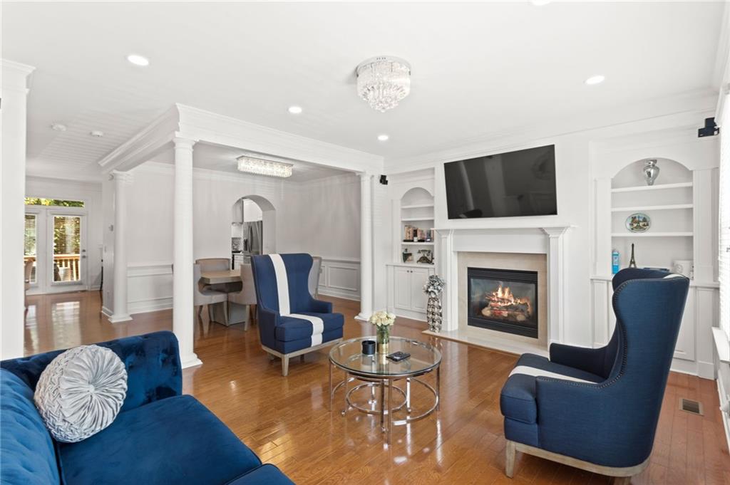 2086 Cobblestone Circle Northeast Atlanta, GA 30319 - Photo 9 of 34 a living room with furniture a flat screen tv and a fireplace