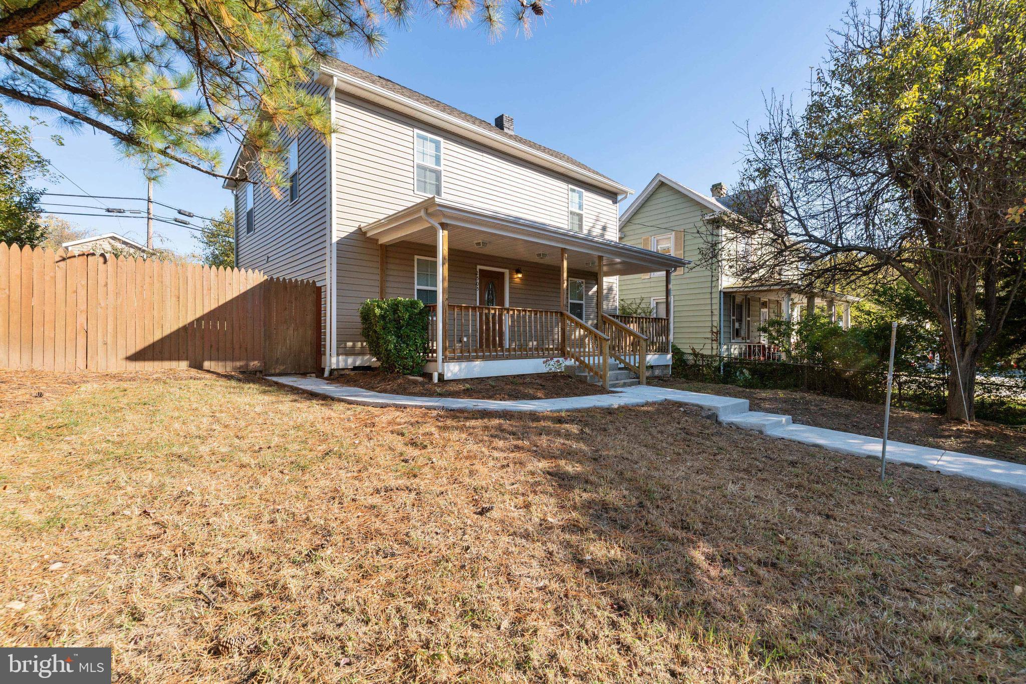2505 Hammonds Ferry Road Baltimore, MD 21227 - Photo 2 of 36 a front view of a house with a yard