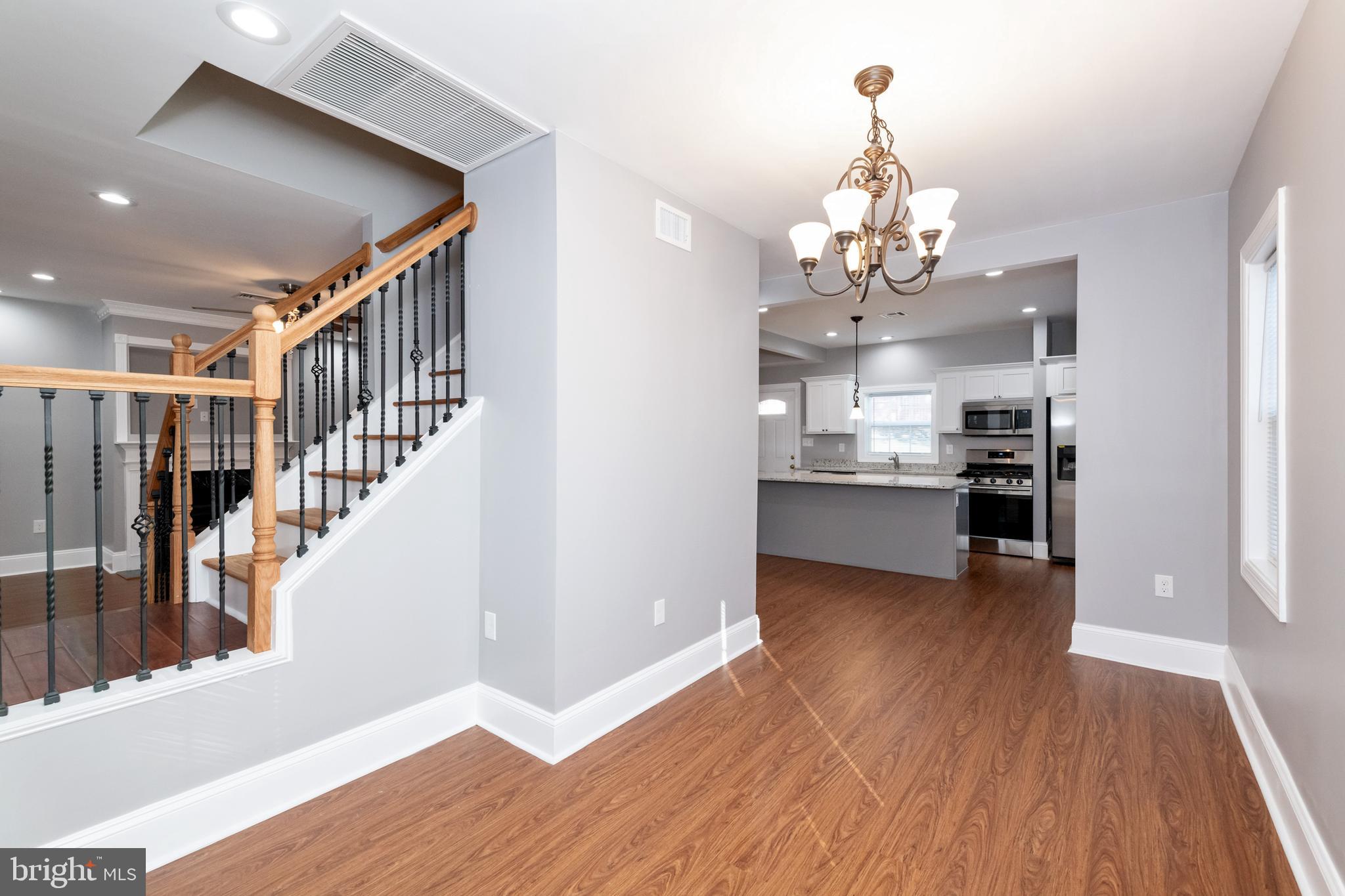 2505 Hammonds Ferry Road Baltimore, MD 21227 - Photo 16 of 36 a view of a kitchen with wooden floor and a kitchen