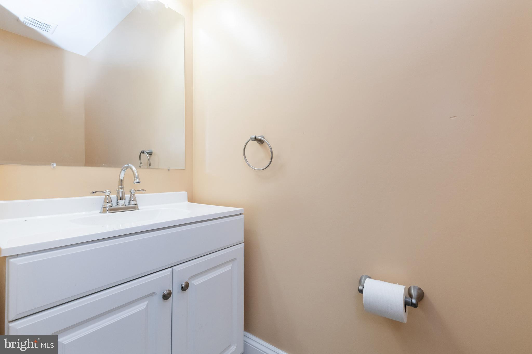 2505 Hammonds Ferry Road Baltimore, MD 21227 - Photo 19 of 36 a bathroom with a sink and mirror