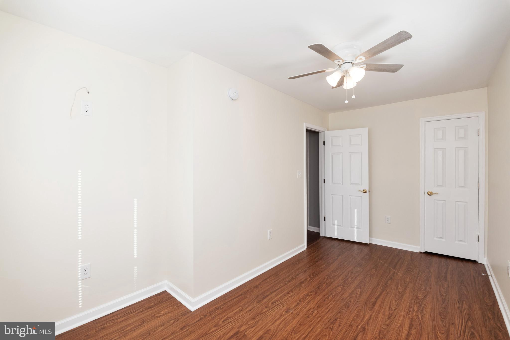 2505 Hammonds Ferry Road Baltimore, MD 21227 - Photo 32 of 36 a view of a room with wooden floor and white walls