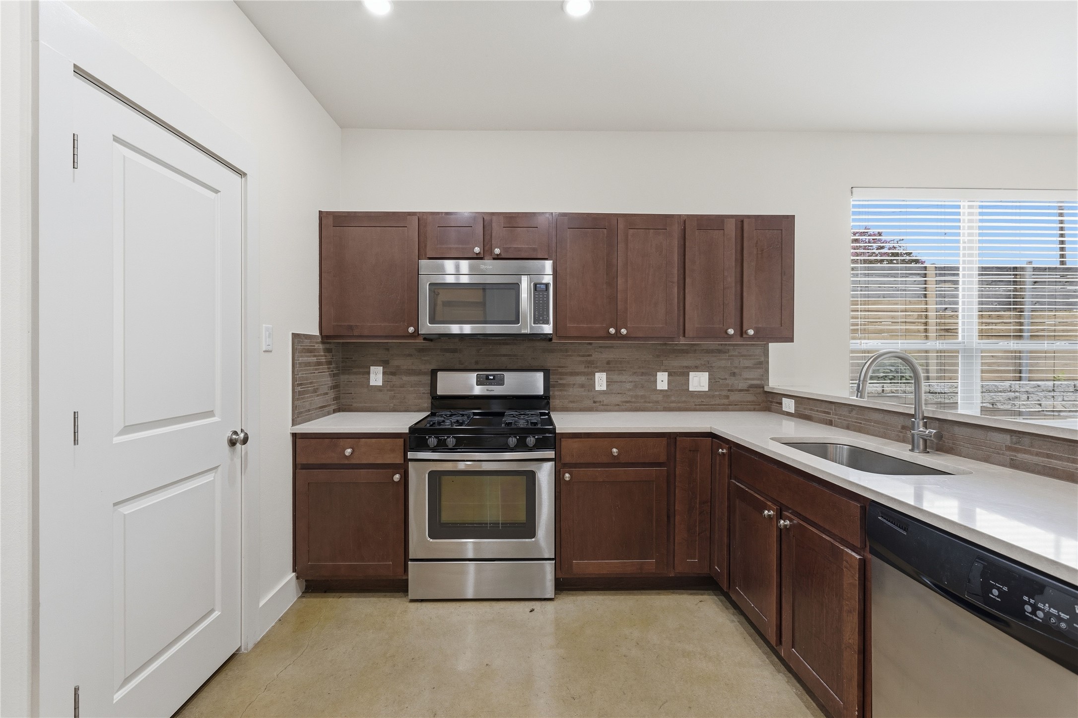 4124 Valley View Road, Unit 4A & 4B Austin, TX 78704 - Photo 9 of 40 Discover a well-appointed kitchen featuring a gas range and stainless steel appliances, perfect for culinary endeavors.