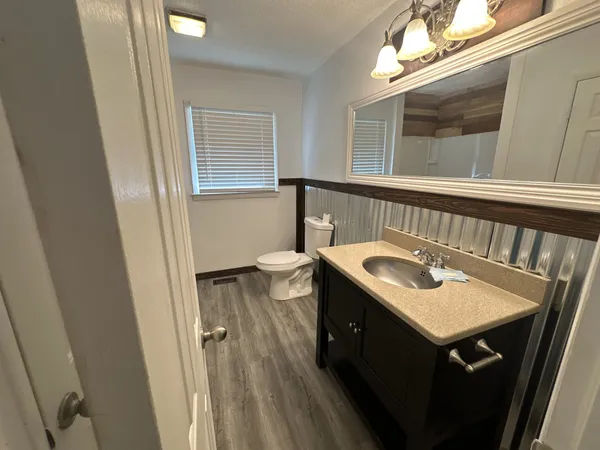 a bathroom with a tub a sink and a shower