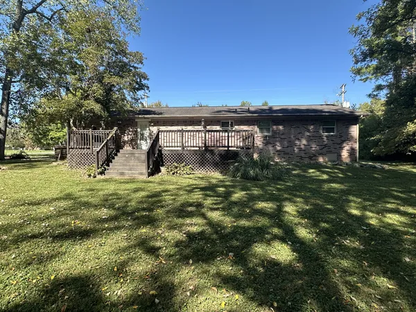 a backyard of a house with lots of green space