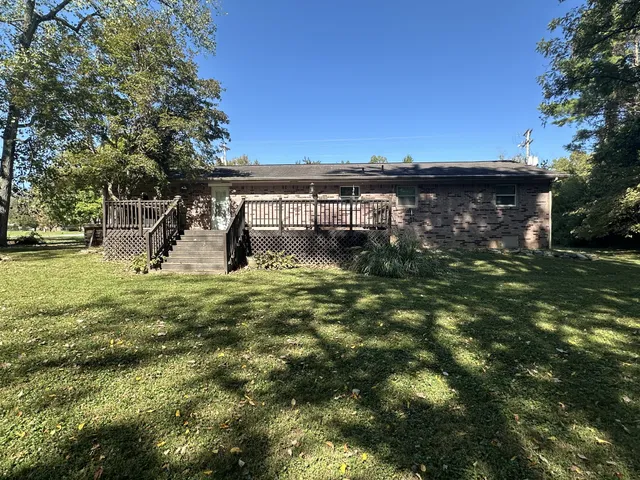 a backyard of a house with lots of green space