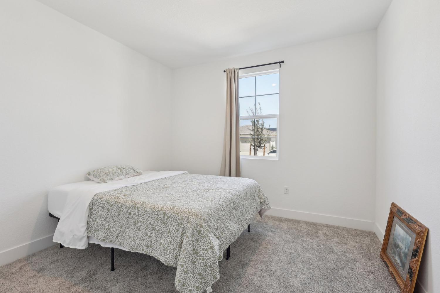 2200 Stagecoach Road Patterson, CA 95363 - Photo 17 of 35 a bedroom with a bed and a window