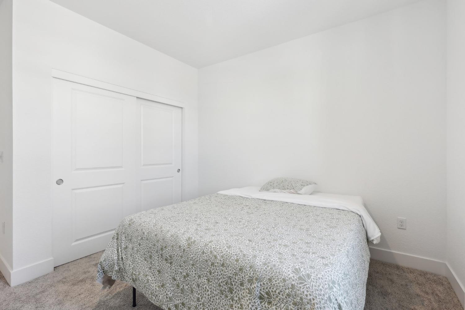 2200 Stagecoach Road Patterson, CA 95363 - Photo 18 of 35 a bedroom with a bed and cabinet