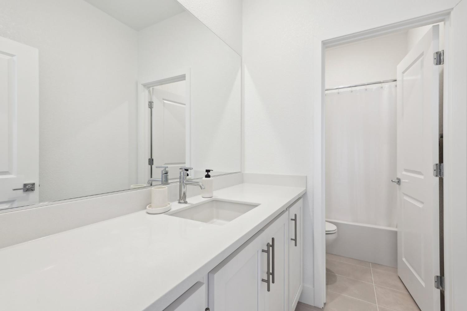 2200 Stagecoach Road Patterson, CA 95363 - Photo 24 of 35 a bathroom with a sink and a mirror