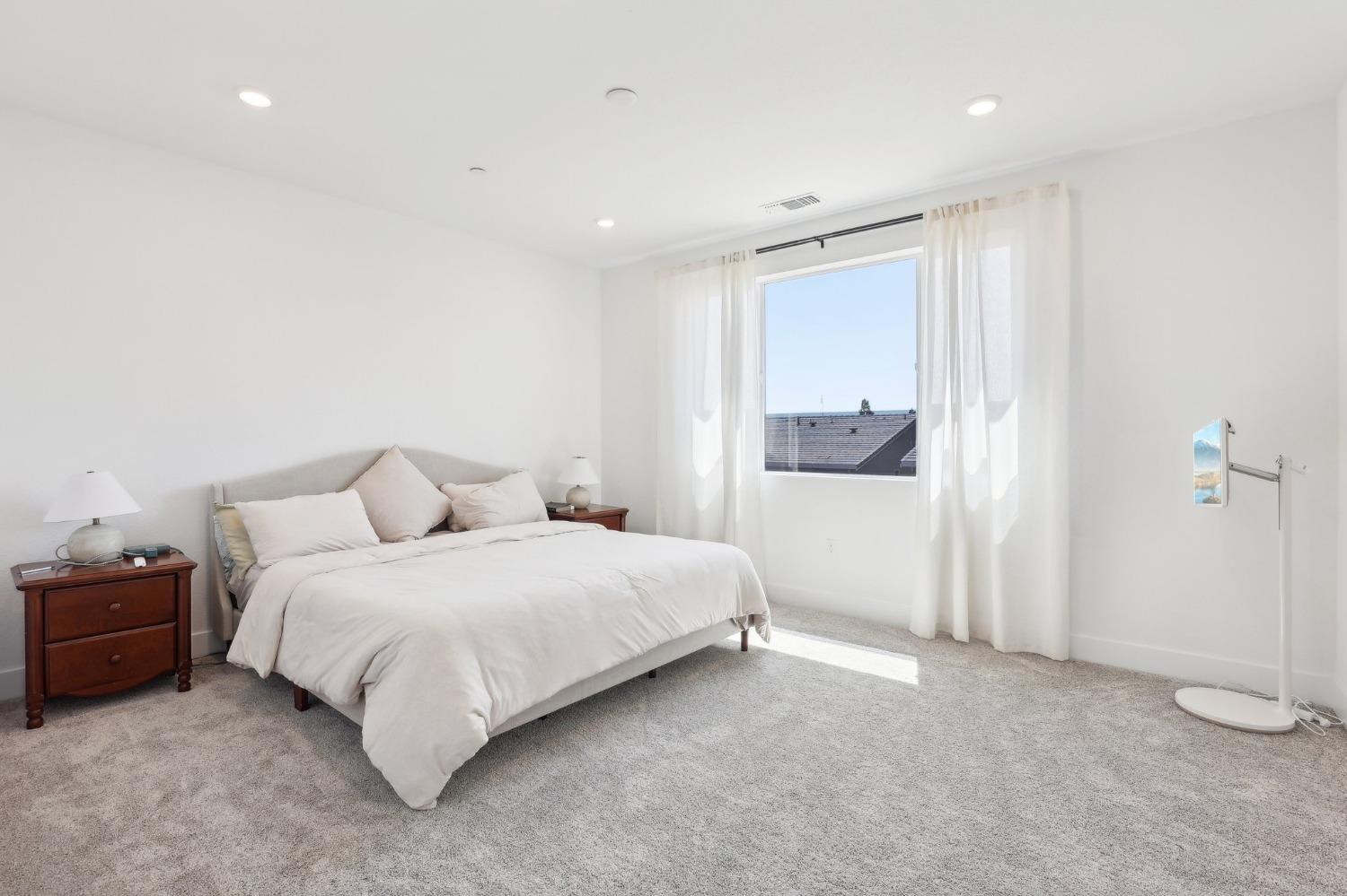 2200 Stagecoach Road Patterson, CA 95363 - Photo 27 of 35 a spacious bedroom with a bed and cabinet