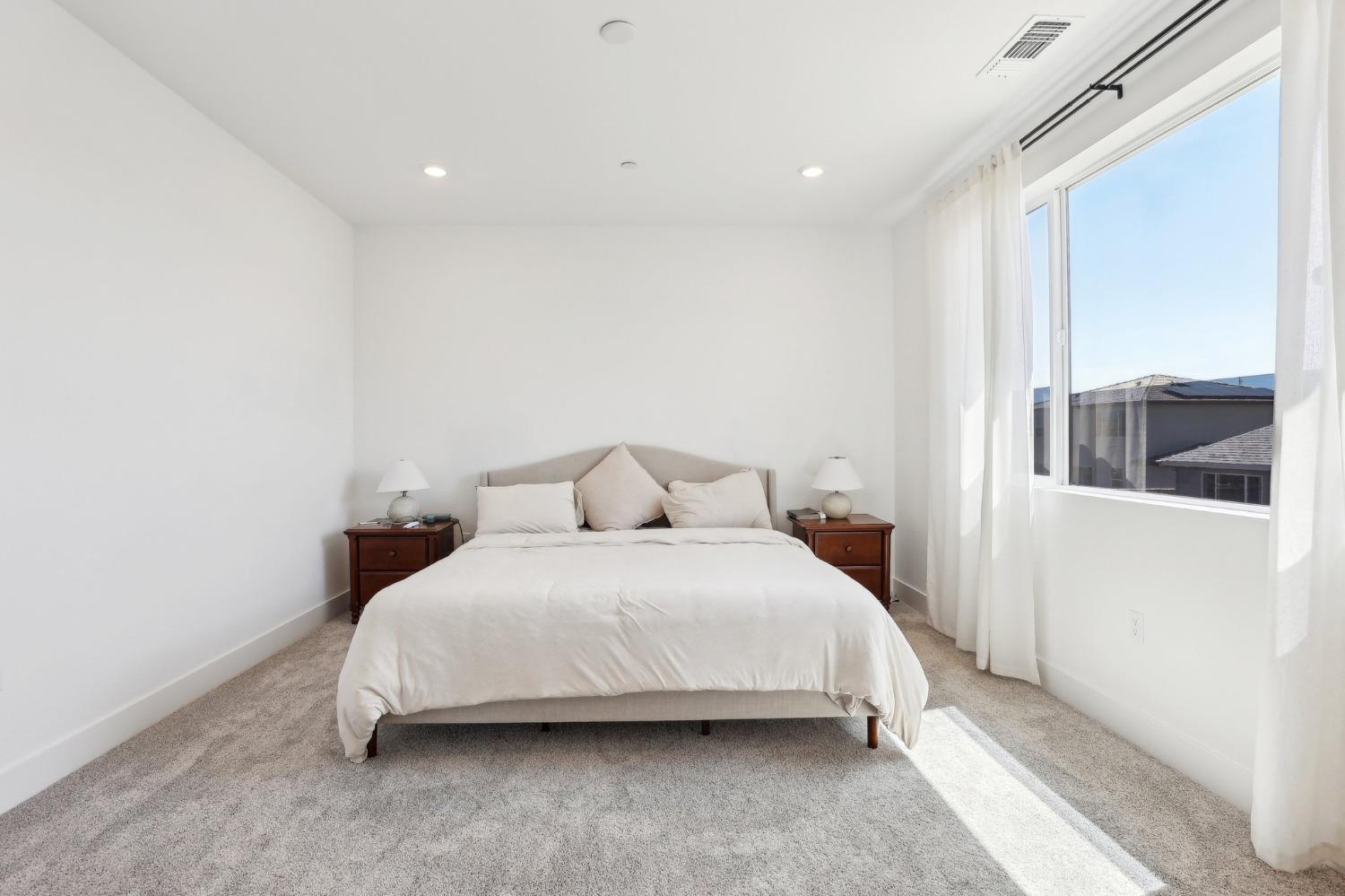 2200 Stagecoach Road Patterson, CA 95363 - Photo 28 of 35 a spacious bedroom with a bed and a large window