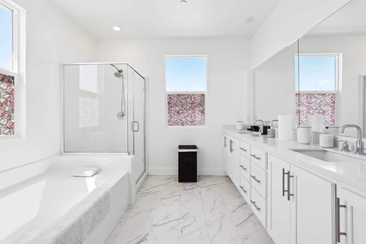 2200 Stagecoach Road Patterson, CA 95363 - Photo 31 of 35 a bathroom with a tub sink and mirror