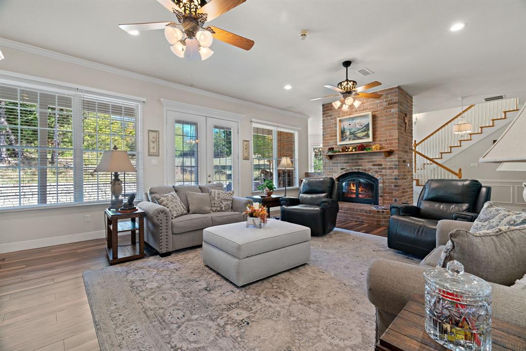72 Crown Road Willow Park, TX 76087 - Photo 10 of 40 a living room with furniture fireplace and a large window