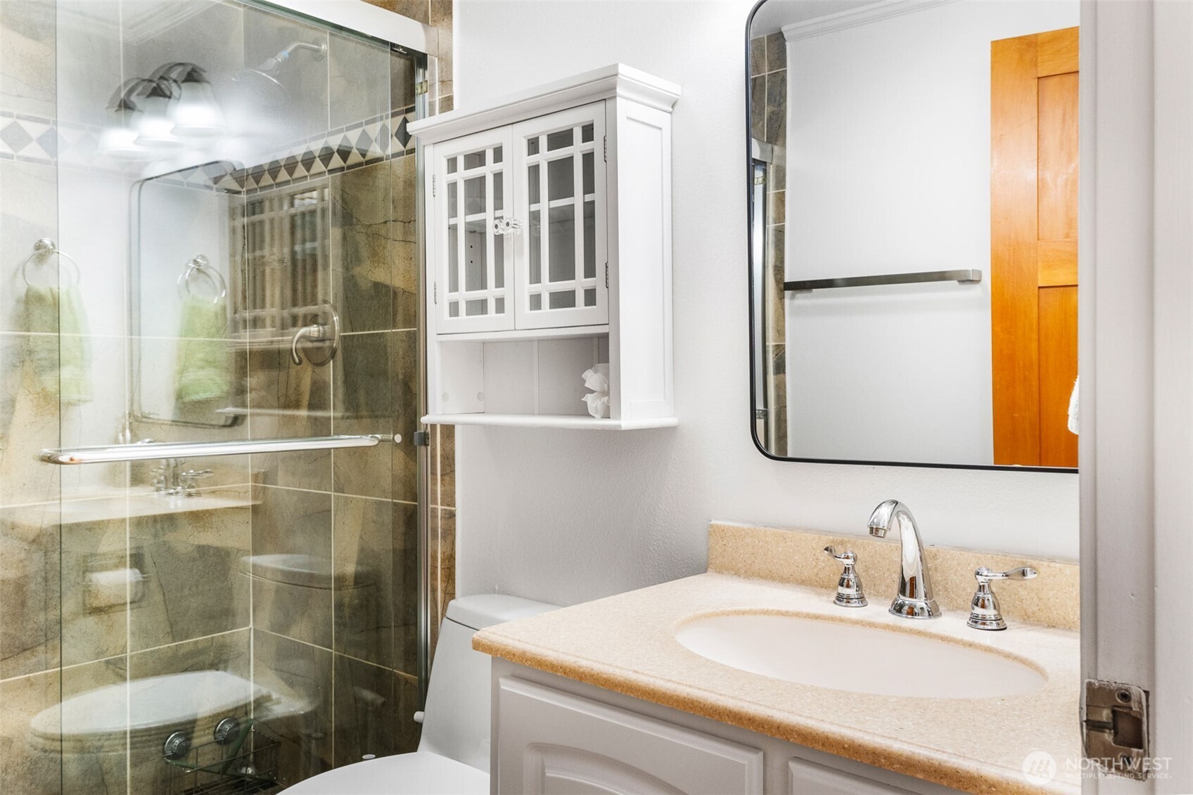 2400 East Howell Street, Unit G Seattle, WA 98122 - Photo 12 of 31 a bathroom with a sink and a mirror