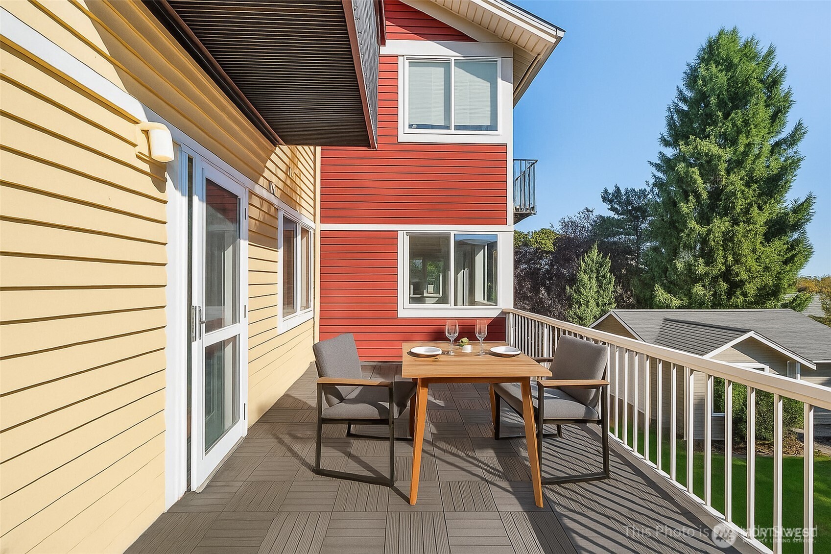 2400 East Howell Street, Unit G Seattle, WA 98122 - Photo 19 of 31 a backyard of a house with wooden chairs and barbeque oven