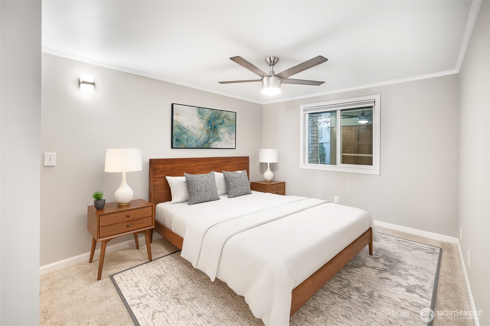 2400 East Howell Street, Unit G Seattle, WA 98122 - Photo 24 of 31 a bedroom with a large bed and a chandelier