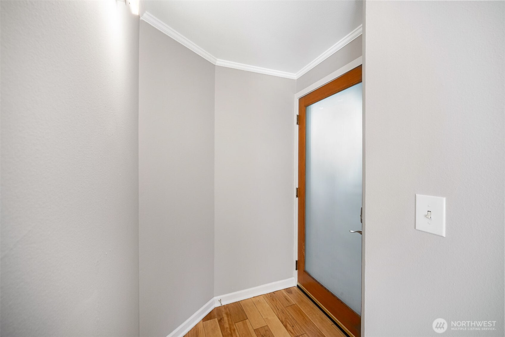 2400 East Howell Street, Unit G Seattle, WA 98122 - Photo 28 of 31 a view of front door with wooden floor