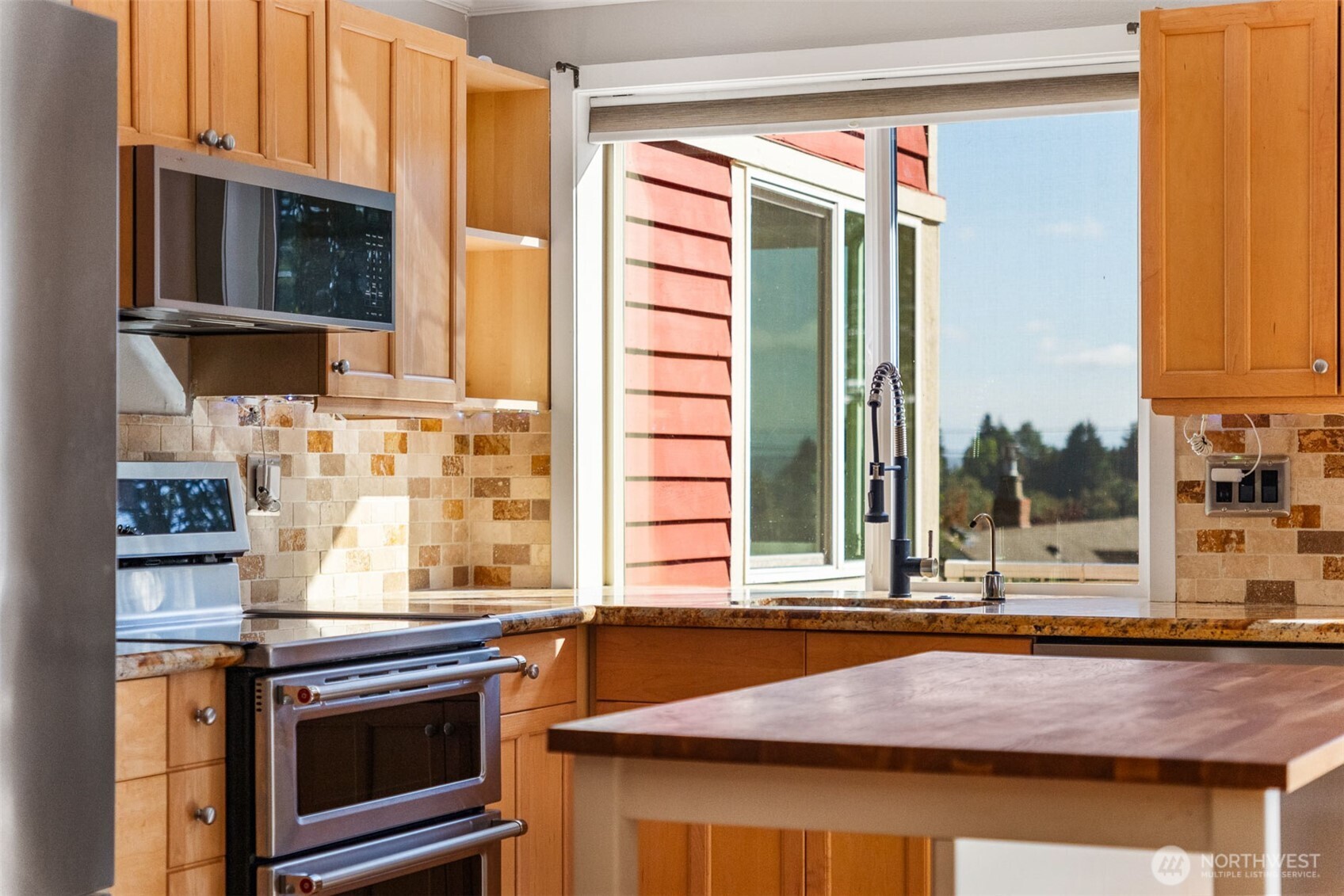 2400 East Howell Street, Unit G Seattle, WA 98122 - Photo 8 of 31 a kitchen with a stove and a microwave