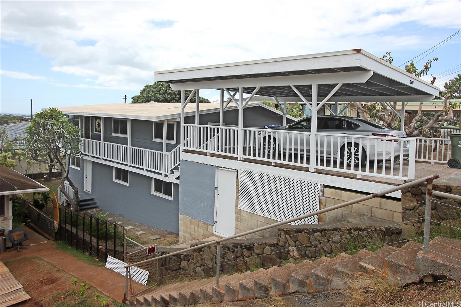 3647 Aliamanu Street Honolulu, HI 96818 - Photo 1 of 16 front view of a house with a deck