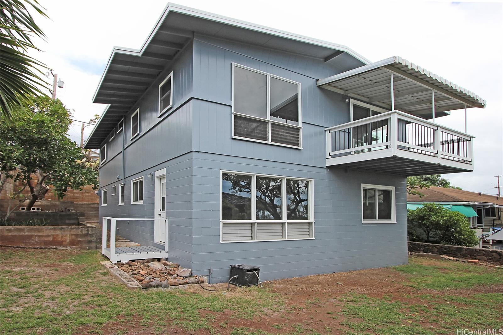 3647 Aliamanu Street Honolulu, HI 96818 - Photo 12 of 16 a front view of a house with garden