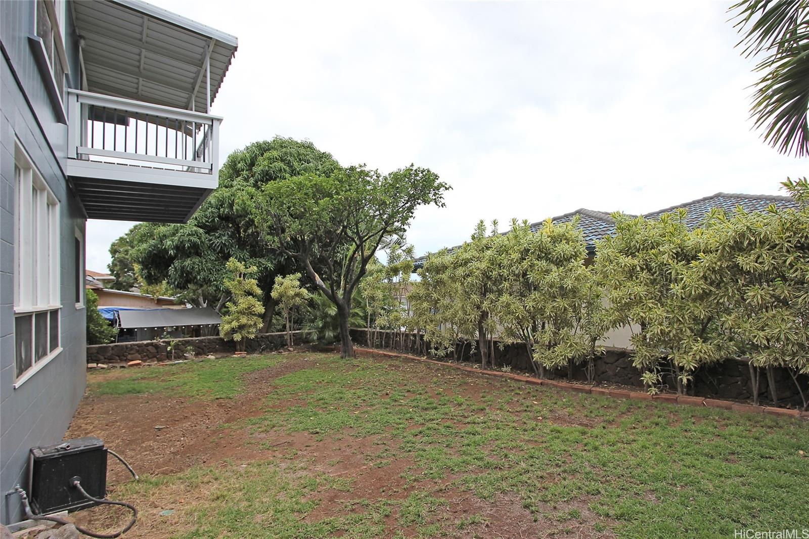 3647 Aliamanu Street Honolulu, HI 96818 - Photo 14 of 16 a backyard of a house with lots of green space