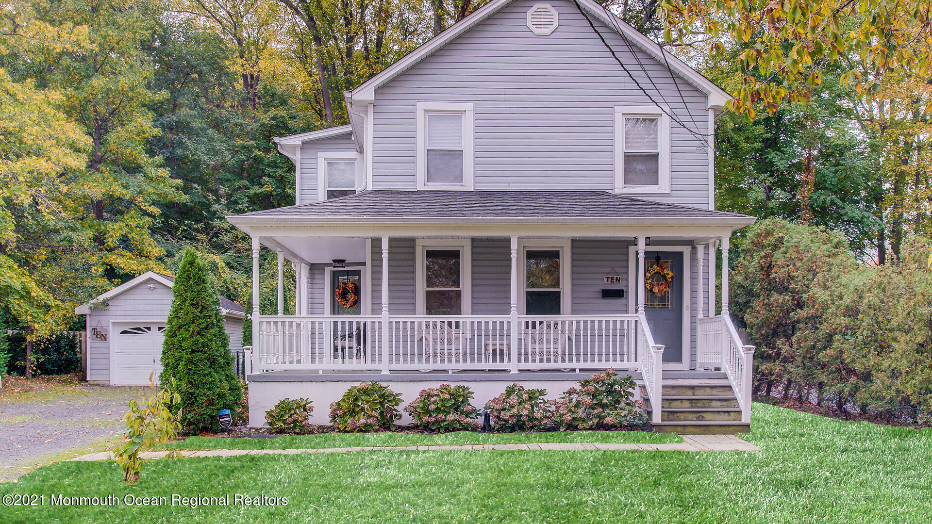10 Cherry Tree Farm Road Middletown, NJ 07748 - Photo 2 of 43 a front view of a house with a garden and plants