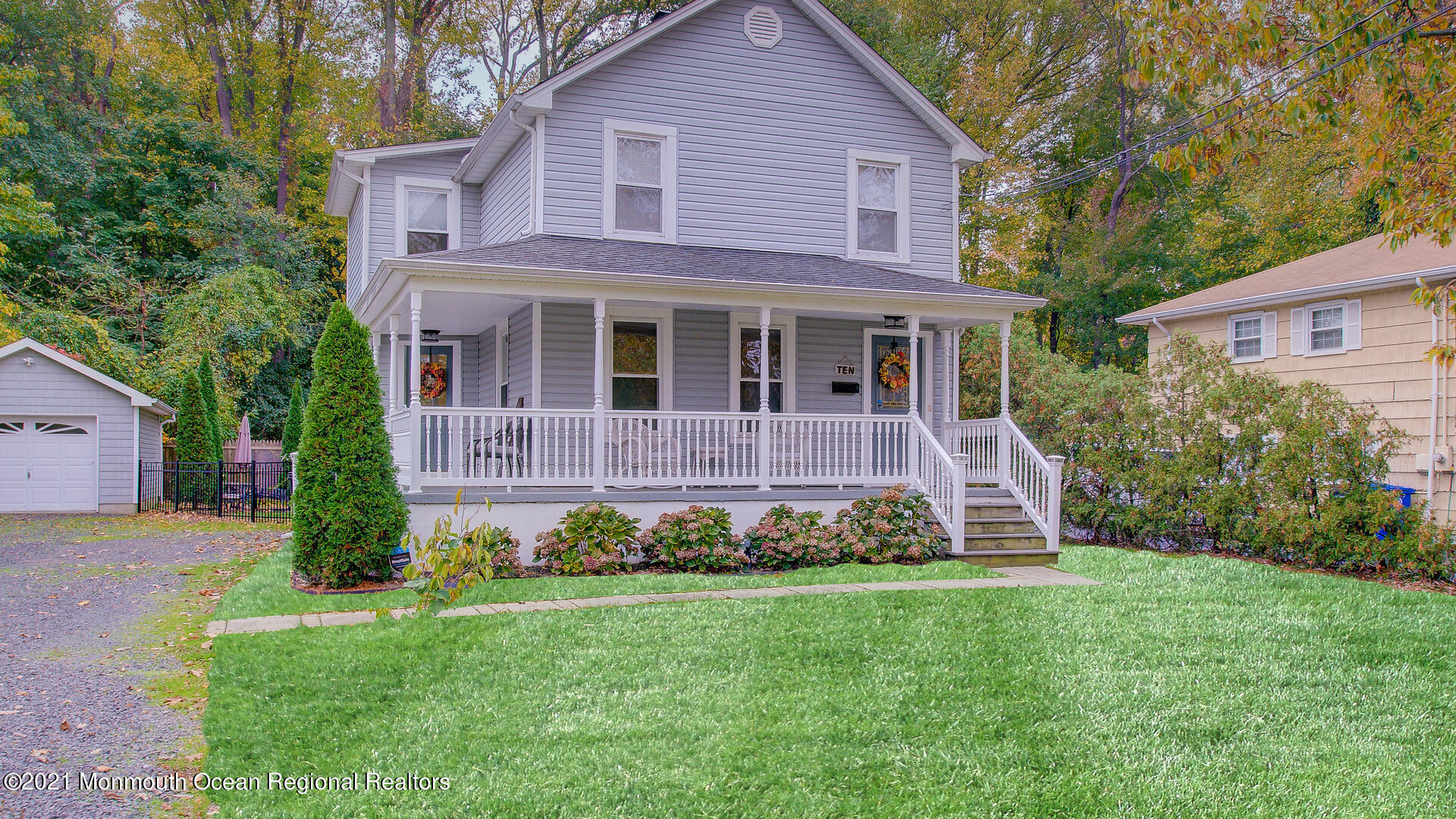 10 Cherry Tree Farm Road Middletown, NJ 07748 - Photo 3 of 43 a front view of a house with a garden
