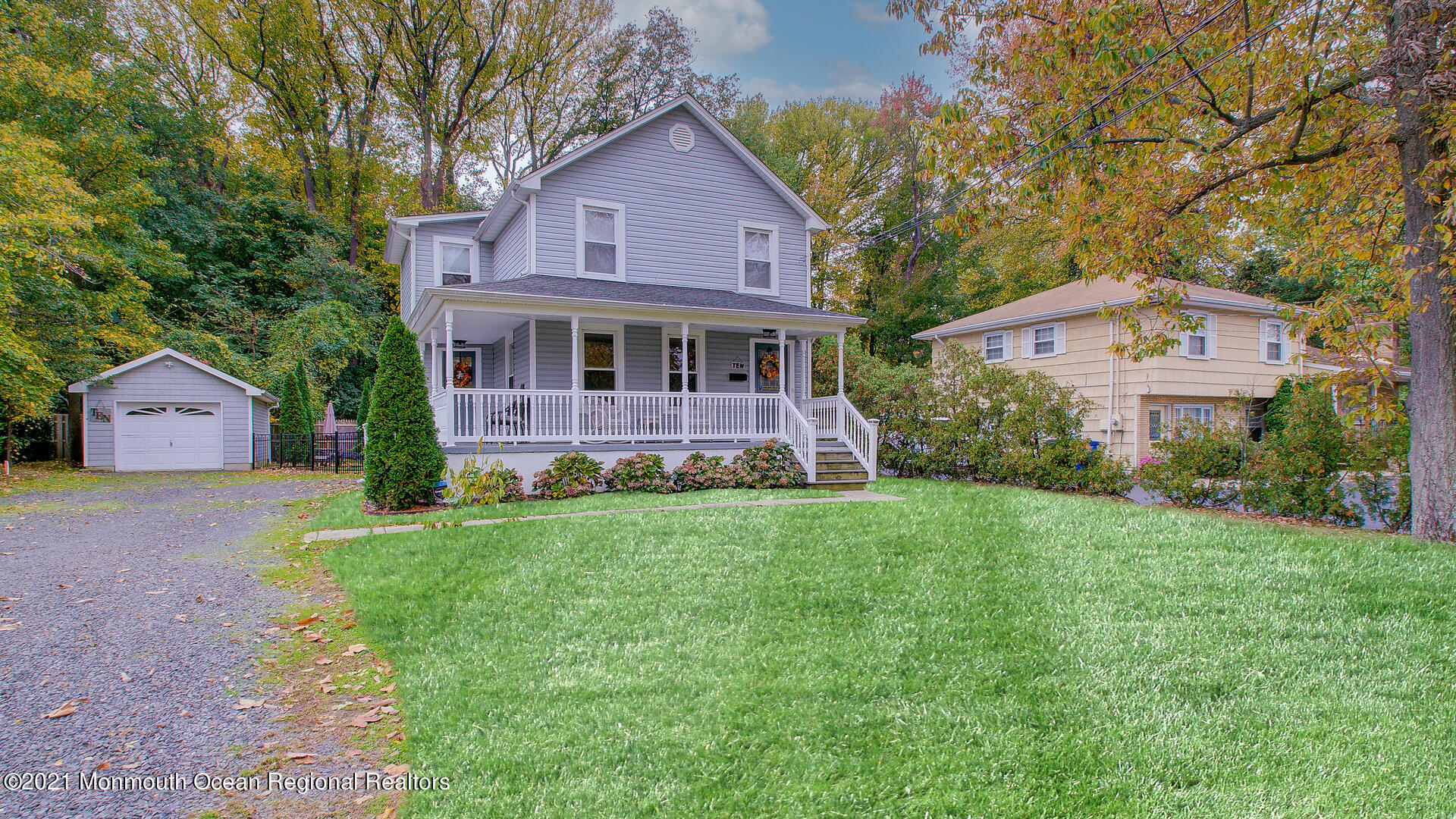 10 Cherry Tree Farm Road Middletown, NJ 07748 - Photo 4 of 43 a front view of a house with a yard and garage
