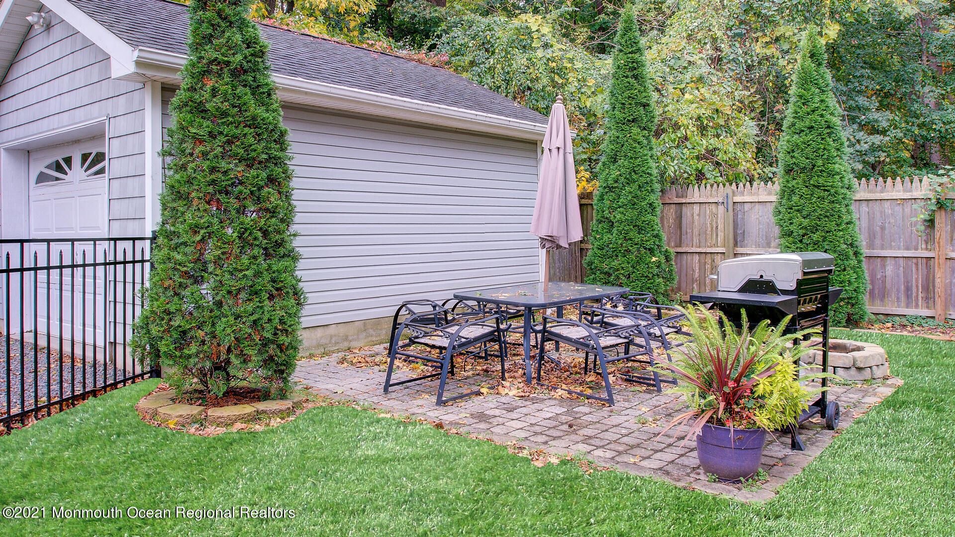 10 Cherry Tree Farm Road Middletown, NJ 07748 - Photo 38 of 43 a view of a chair and table in backyard of the house