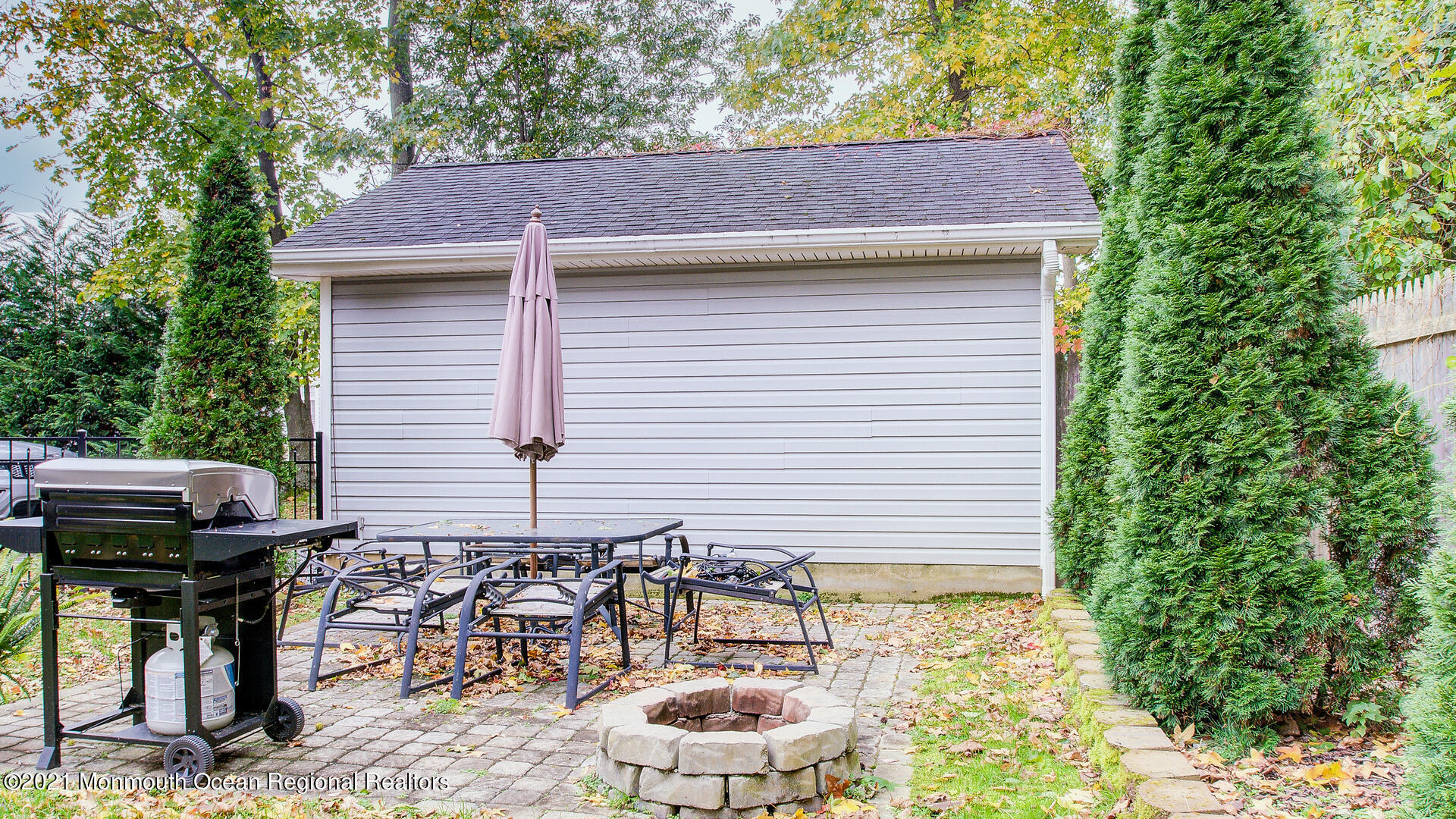 10 Cherry Tree Farm Road Middletown, NJ 07748 - Photo 39 of 43 a view of a patio with table and chairs and potted plants