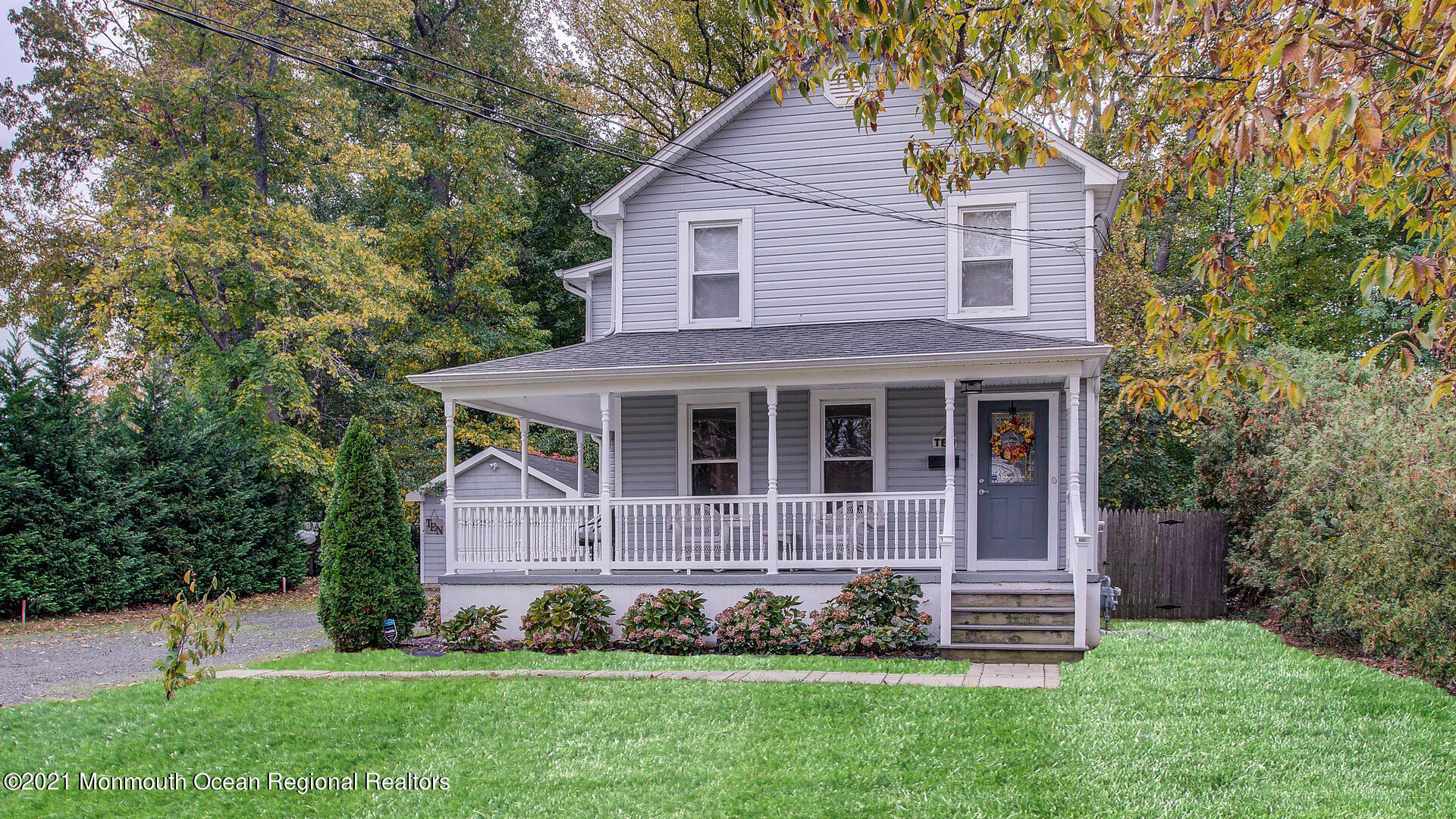 10 Cherry Tree Farm Road Middletown, NJ 07748 - Photo 5 of 43 a front view of a house with a garden and plants