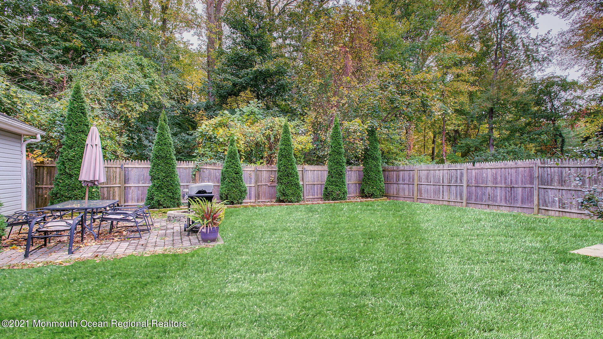 10 Cherry Tree Farm Road Middletown, NJ 07748 - Photo 42 of 43 a view of a chair and table on the garden