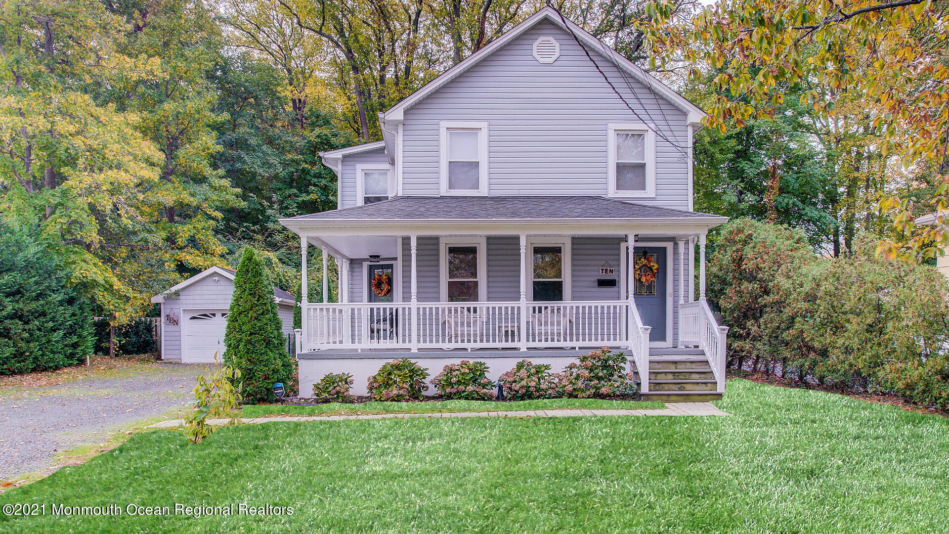10 Cherry Tree Farm Road Middletown, NJ 07748 - Photo 6 of 43 a front view of a house with a garden