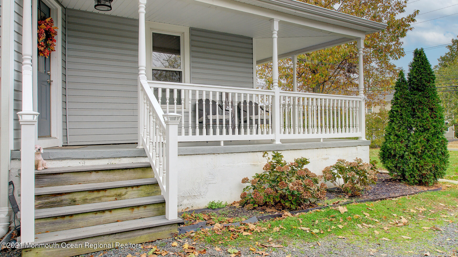 10 Cherry Tree Farm Road Middletown, NJ 07748 - Photo 8 of 43 a view of a porch with a bench