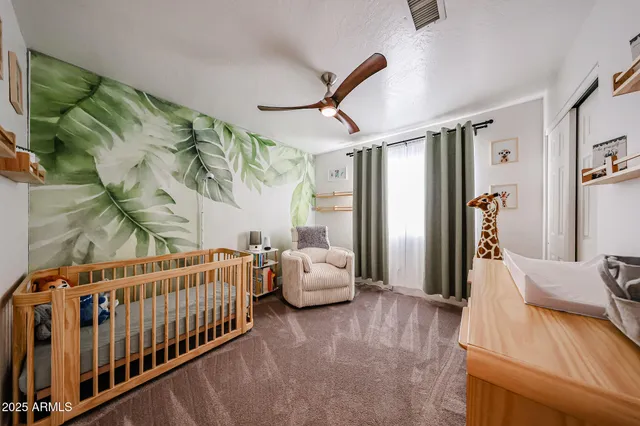 a bedroom with furniture and wooden floor