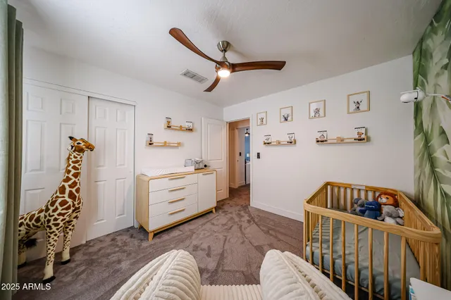 a bedroom with furniture and a window
