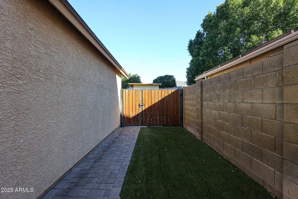 a backyard of a house with lots of green space